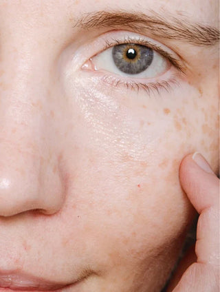 Close-up of skin showing Peptide Serum application results, highlighting smoothness and hydration.