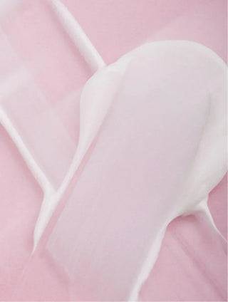 Collagen Night Cream texture on a pink background.